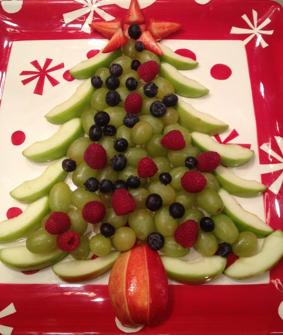christmas tree fruit tray with grapes apples raspberries blueberries strawberries