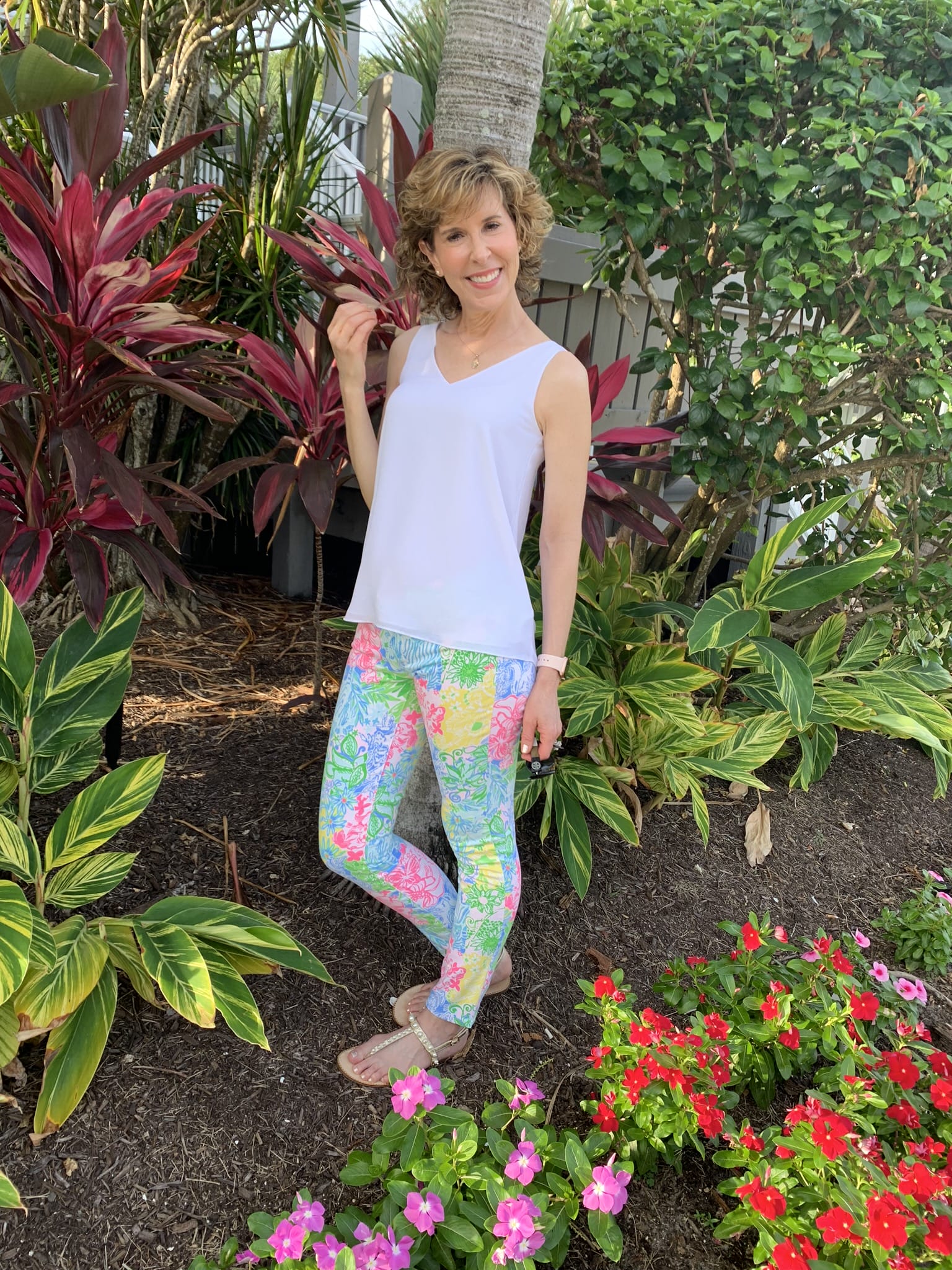 woman in garden setting on sanibel beach trip