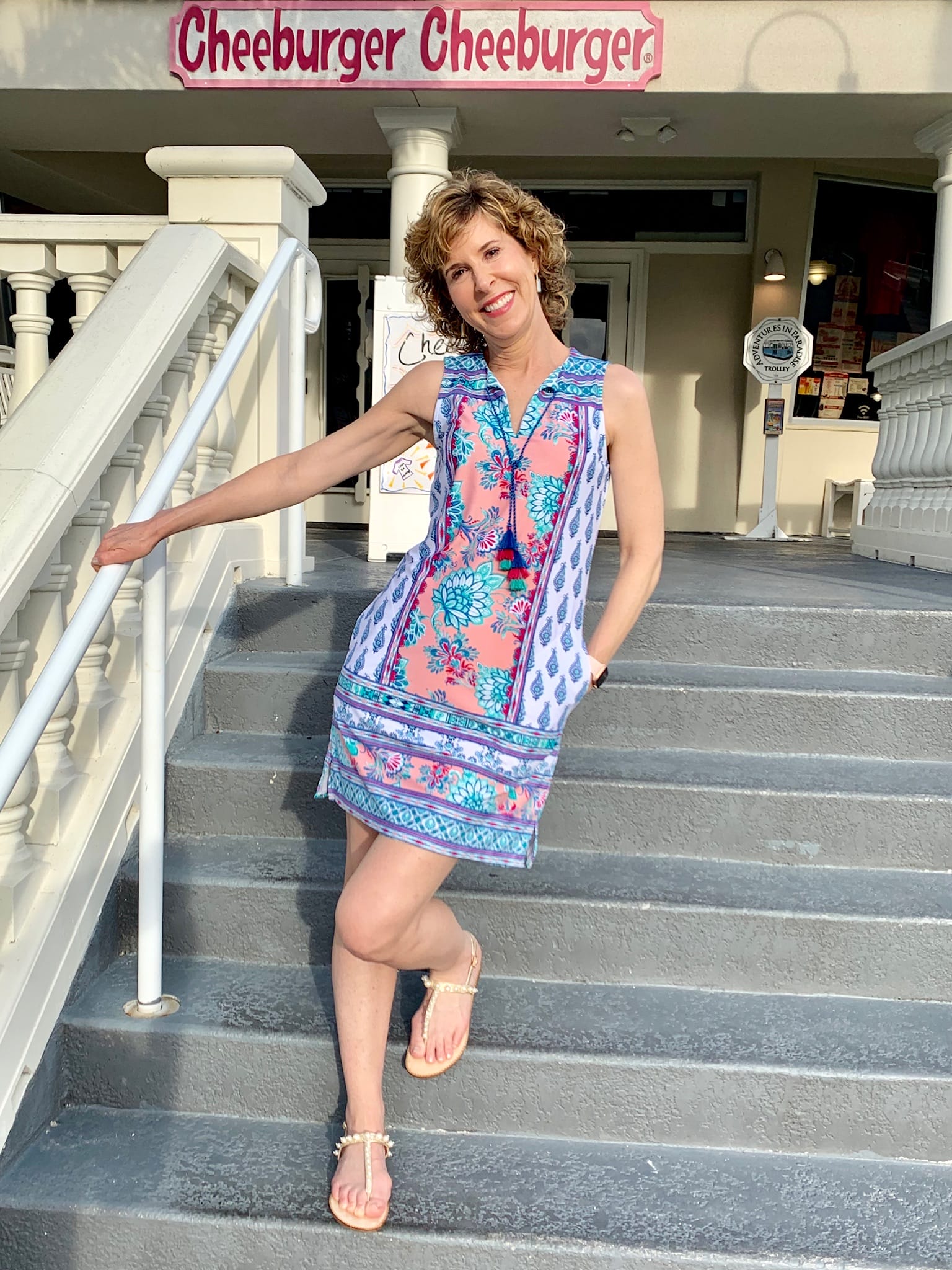 woman posing in front of cheeburger restaurant on sanibel island