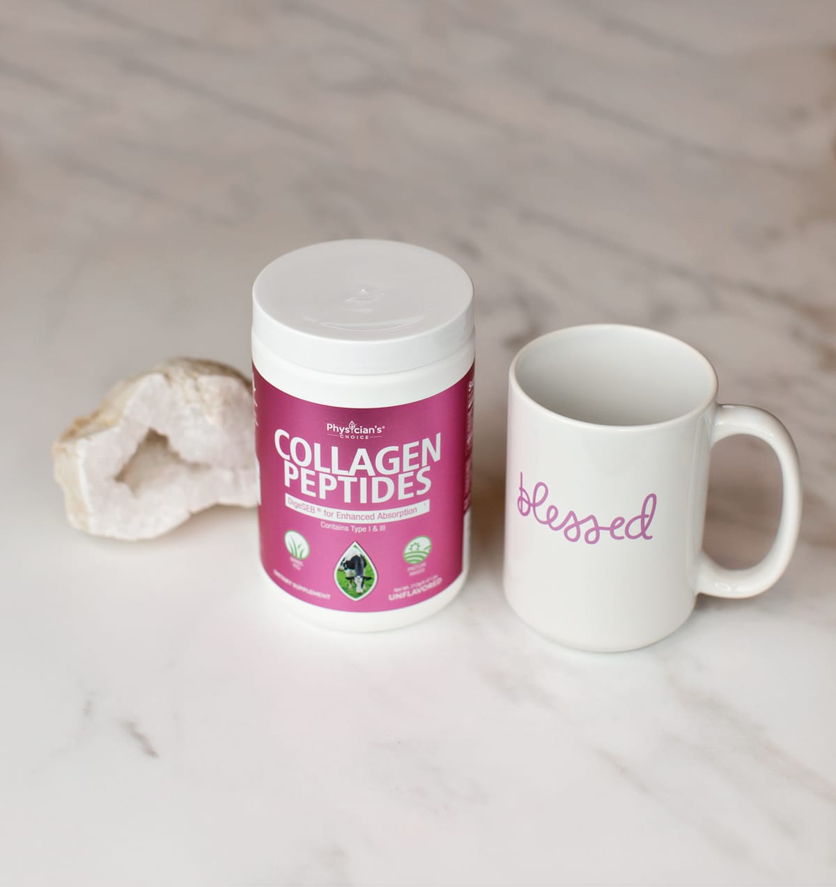 collagen powder and coffee mug on white marble background