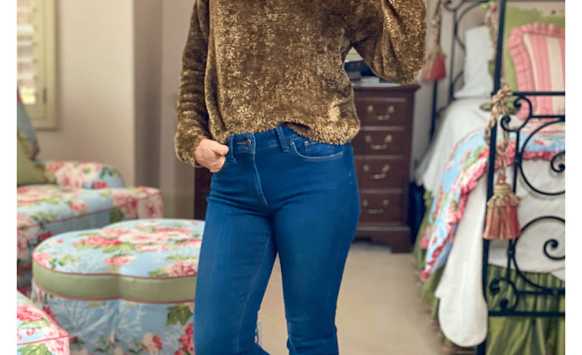 mirror selfie of woman in brown fuzzy sweater