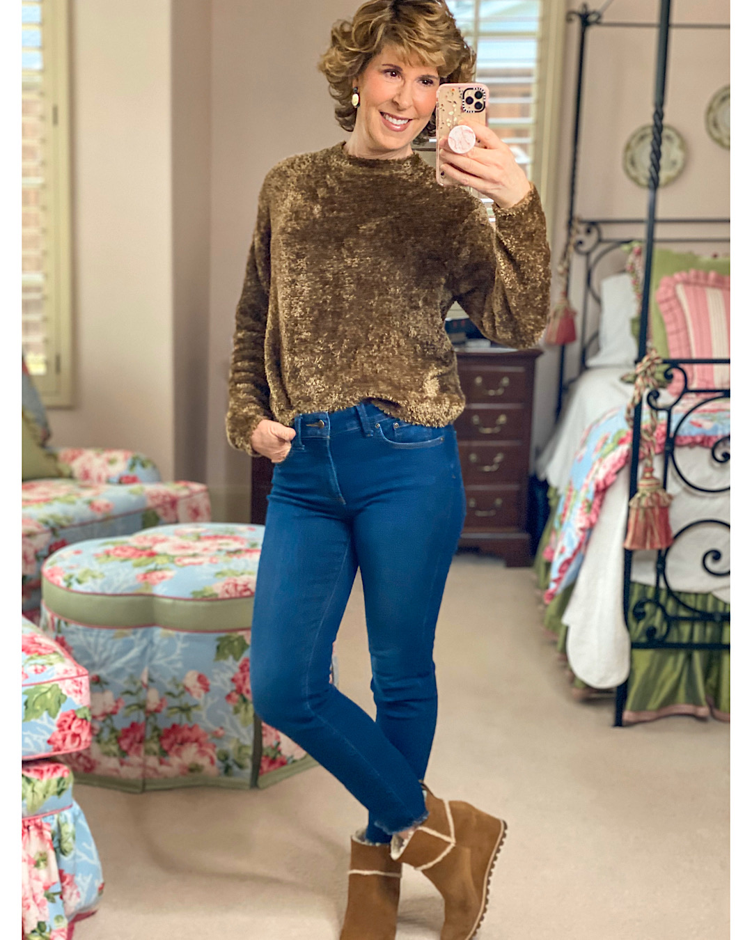 mirror selfie of woman in brown fuzzy sweater