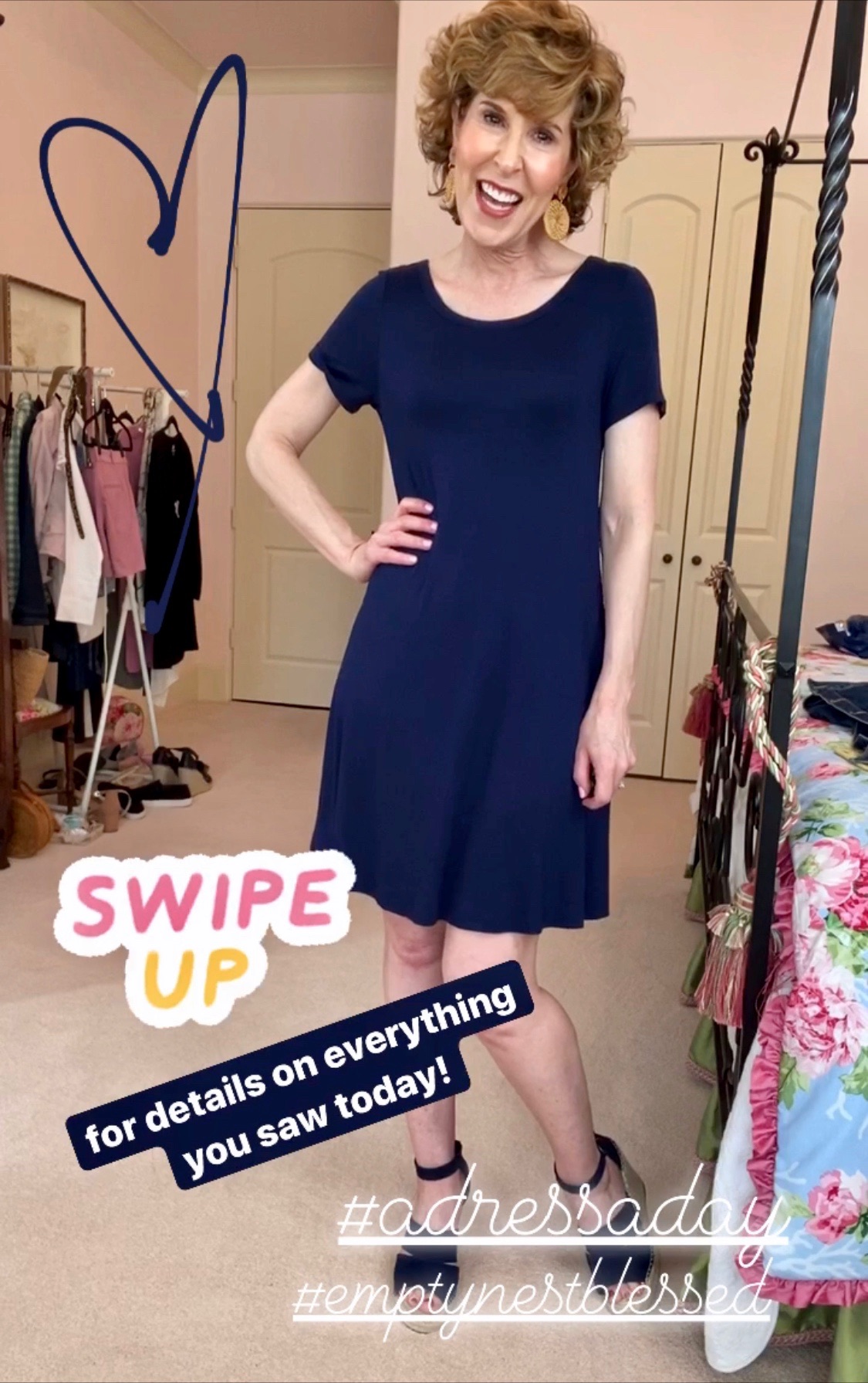 woman in navy blue dress in colorful bedroom with text on photo