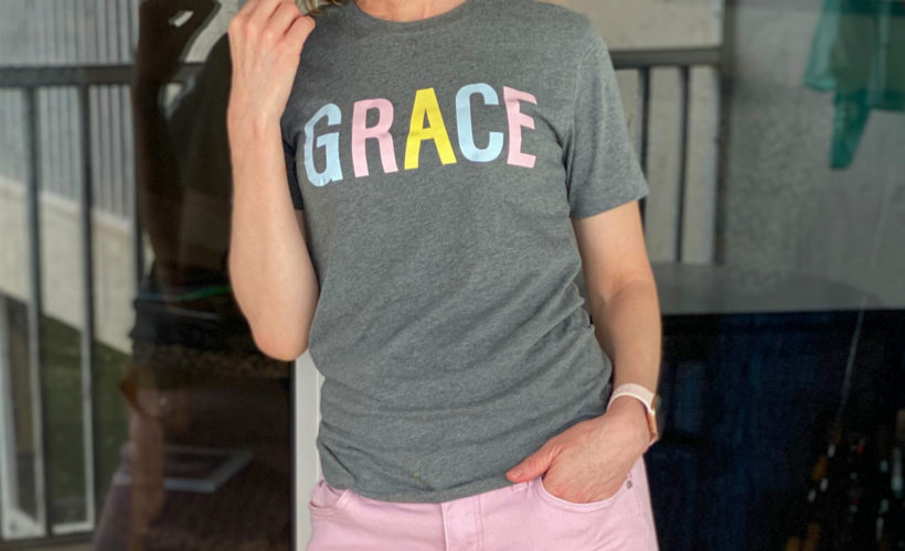 woman standing on patio wearing GRACE tee