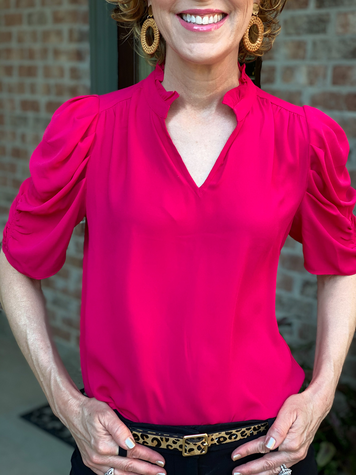 close up of woman wearing lark & ro ruffle neck georgette top