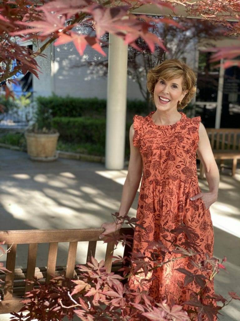 woman standing near trees wearing Floral Print Ruffle Sleeveless Dress - Universal Thread™