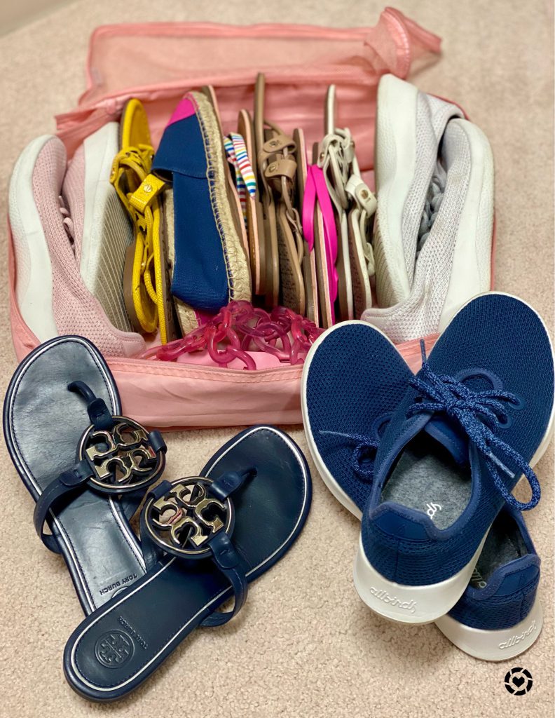 Shoes and flip flops in a pink packing cube