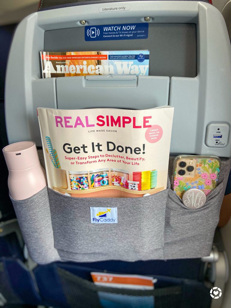 Fly Caddy organizer on an airplane tray table