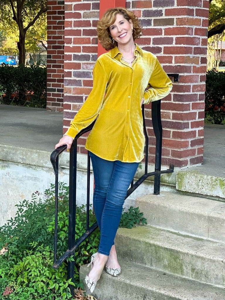 woman wearing soft surrondings icon collection velvet boyfriend shirt and Supremely Soft Relaxed Straight Jeans standing on a staircase