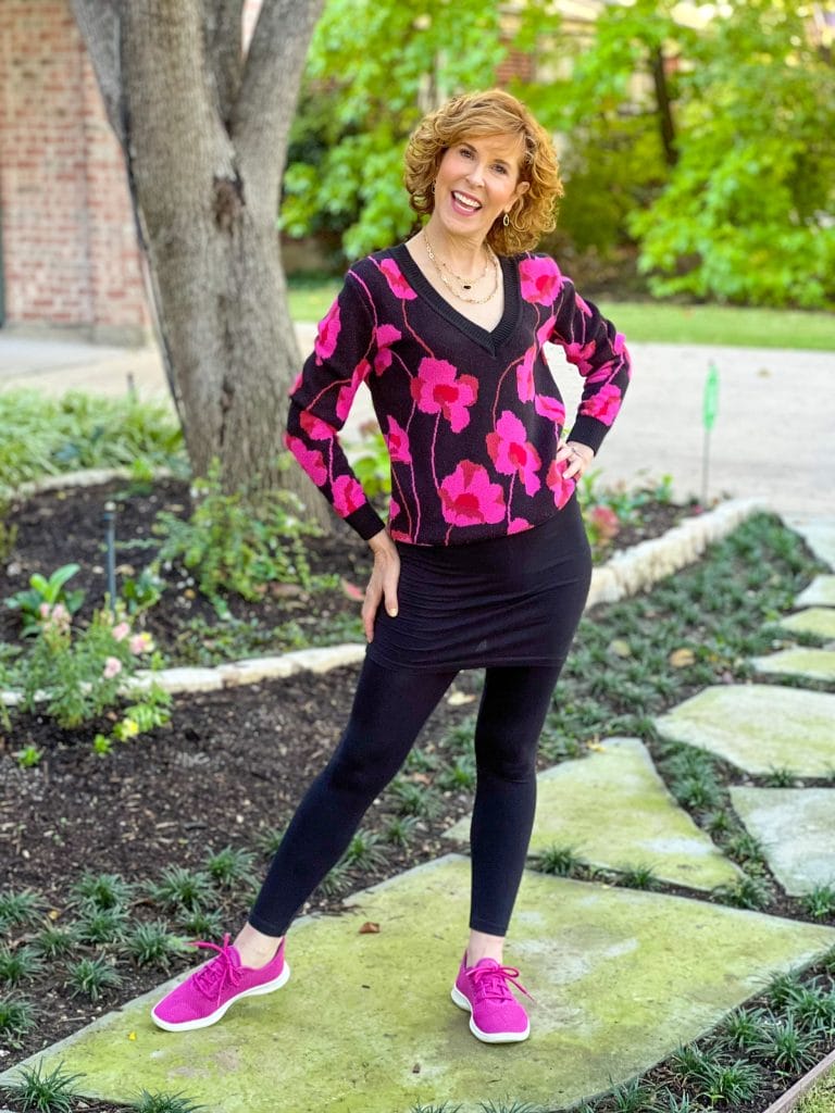 woman in front yard wearing cabi m'leggings and Rococo Pullover with fucshia sneakers