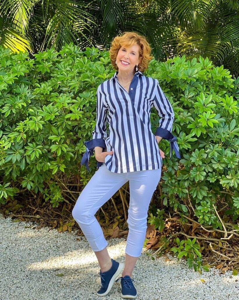 woman wearing chico's Striped No-Iron Bow-Cuff Tunic and No-Stain White Girlfriend Ankle Jeans on the weekend