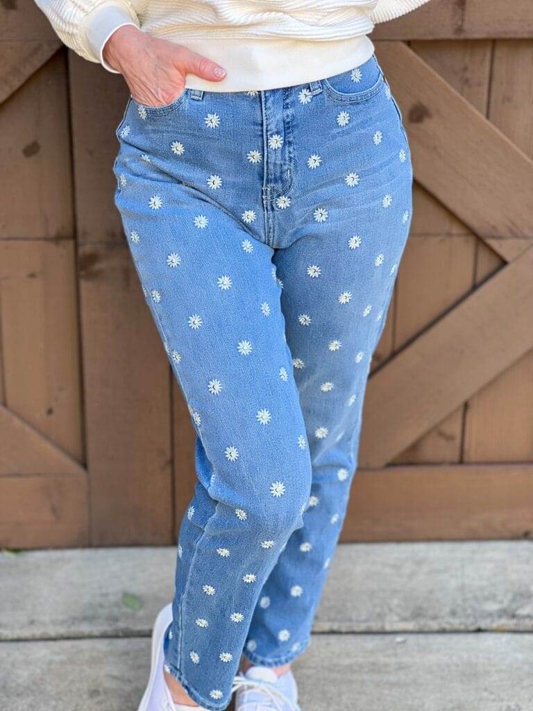 front view of woman standing in front of brown wall wearing Embroidered Mom Jeans from Nordstrom made brand BP