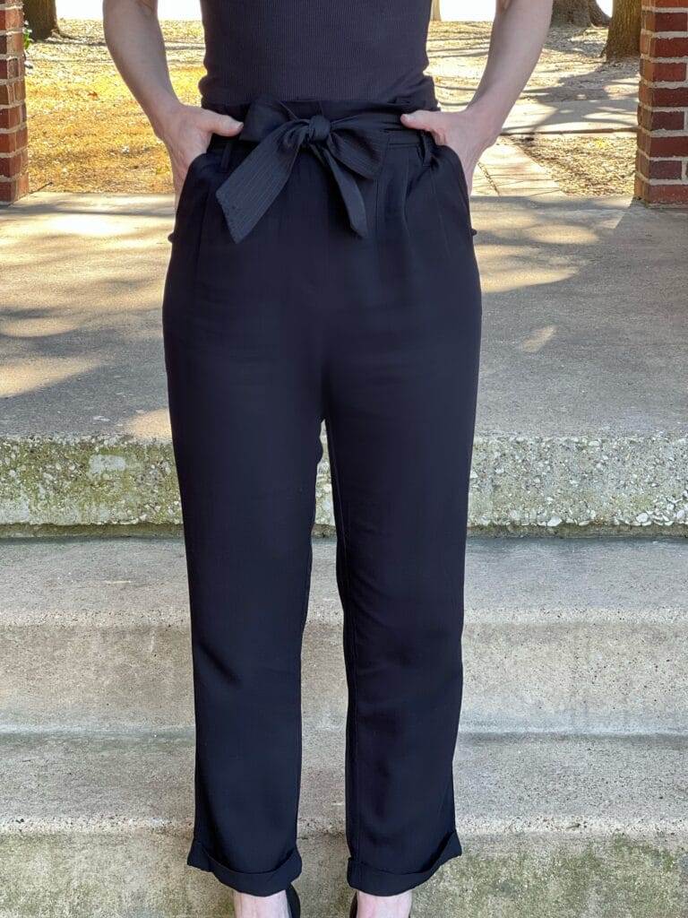 woman wearing black Treasure & Bond Paperbag Waist Pants from Nordstrom