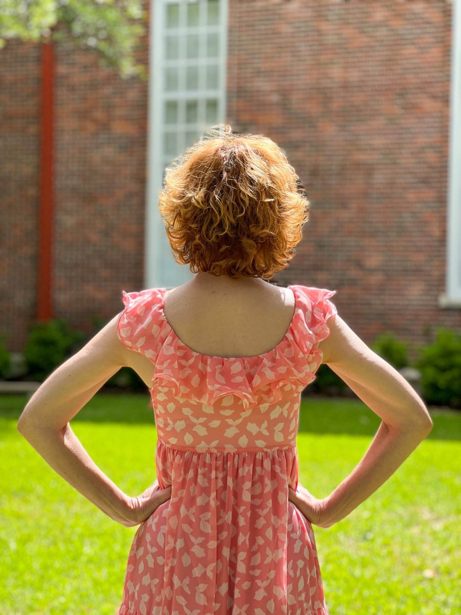 woman from the back wearing Chelsea28 Ruffle Midi Dress from Nordstrom Made Brands