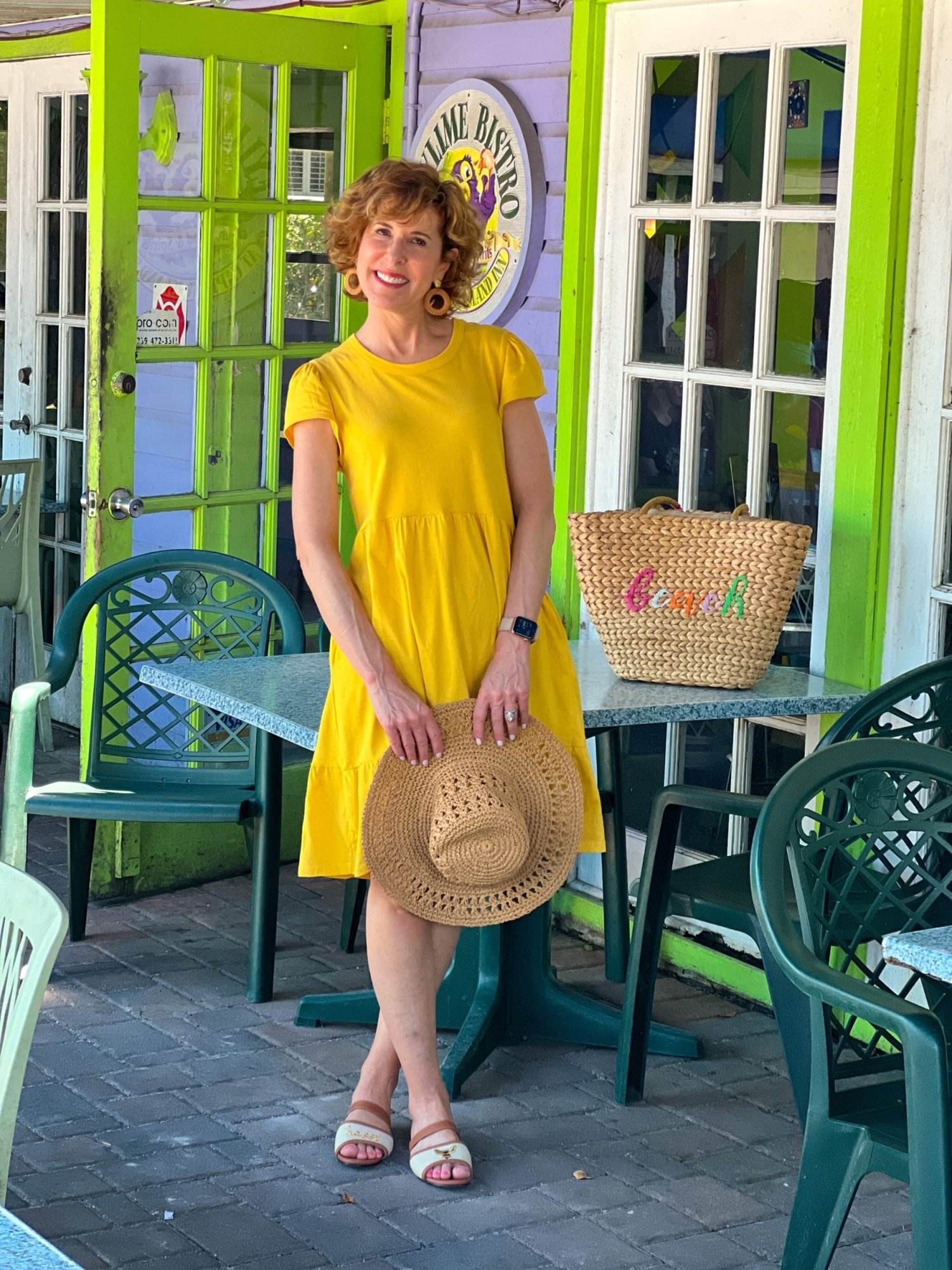 over 50 woman wearing yellow dress at key lime bistro on captiva island