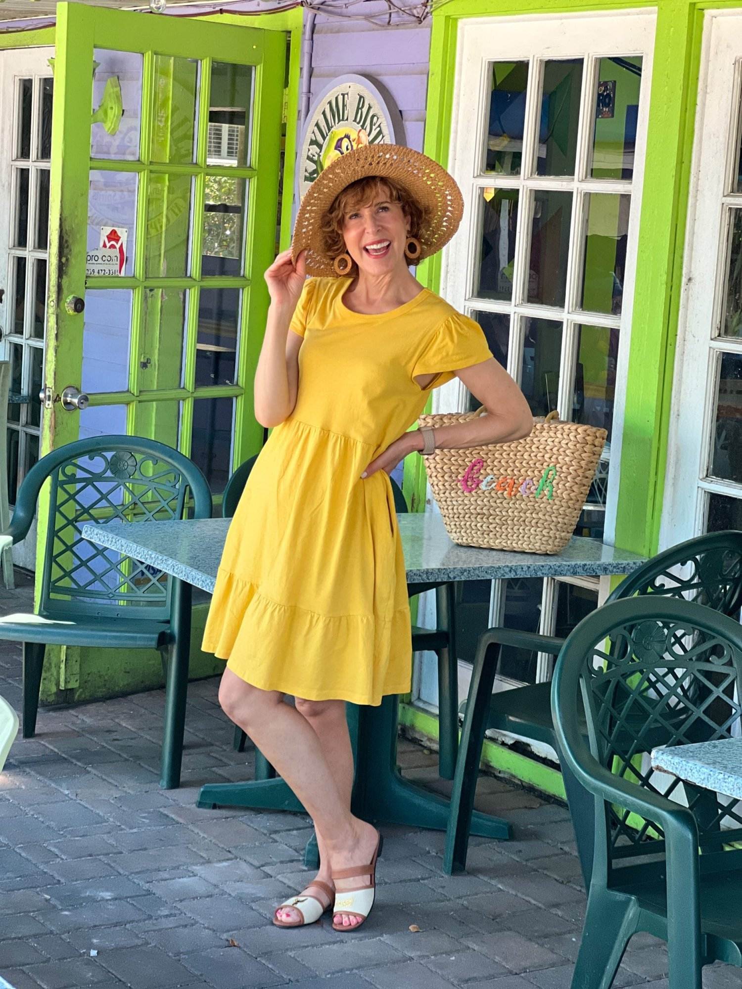 woman over 50 posing at the key lime bistro on captiva island - a day in my life at the beach sometimes includes lunch out