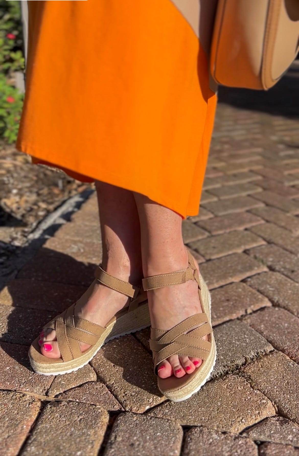 woman’s legs in orange skirt and feet in demi wedge sandals from walmart