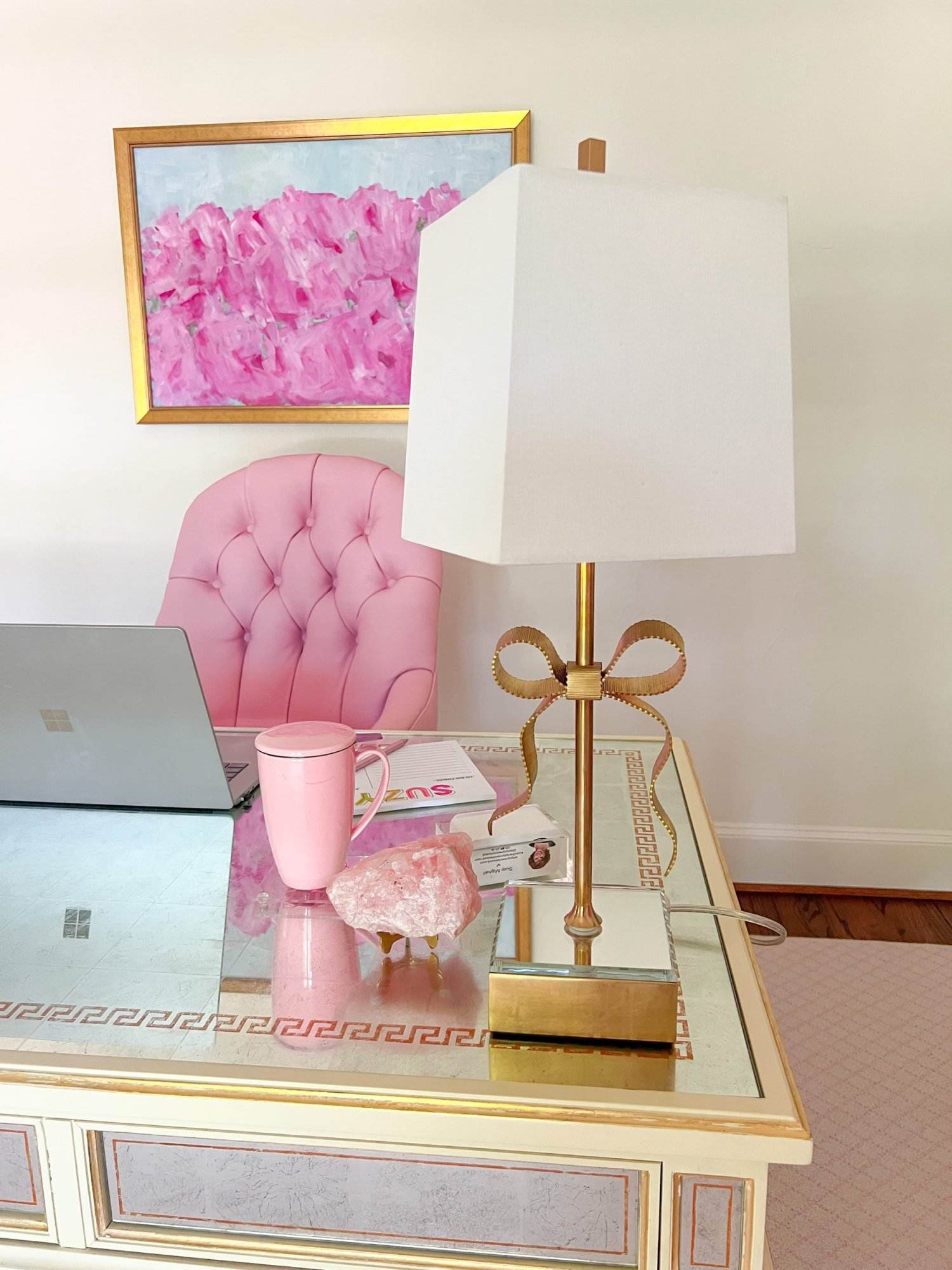 kate spade ellery bow table lamp on side of mirrored desk in pink themed home office