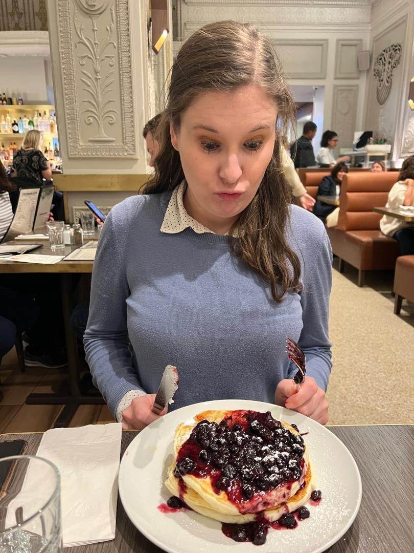 young woman with gluten free waffles at Friedman's