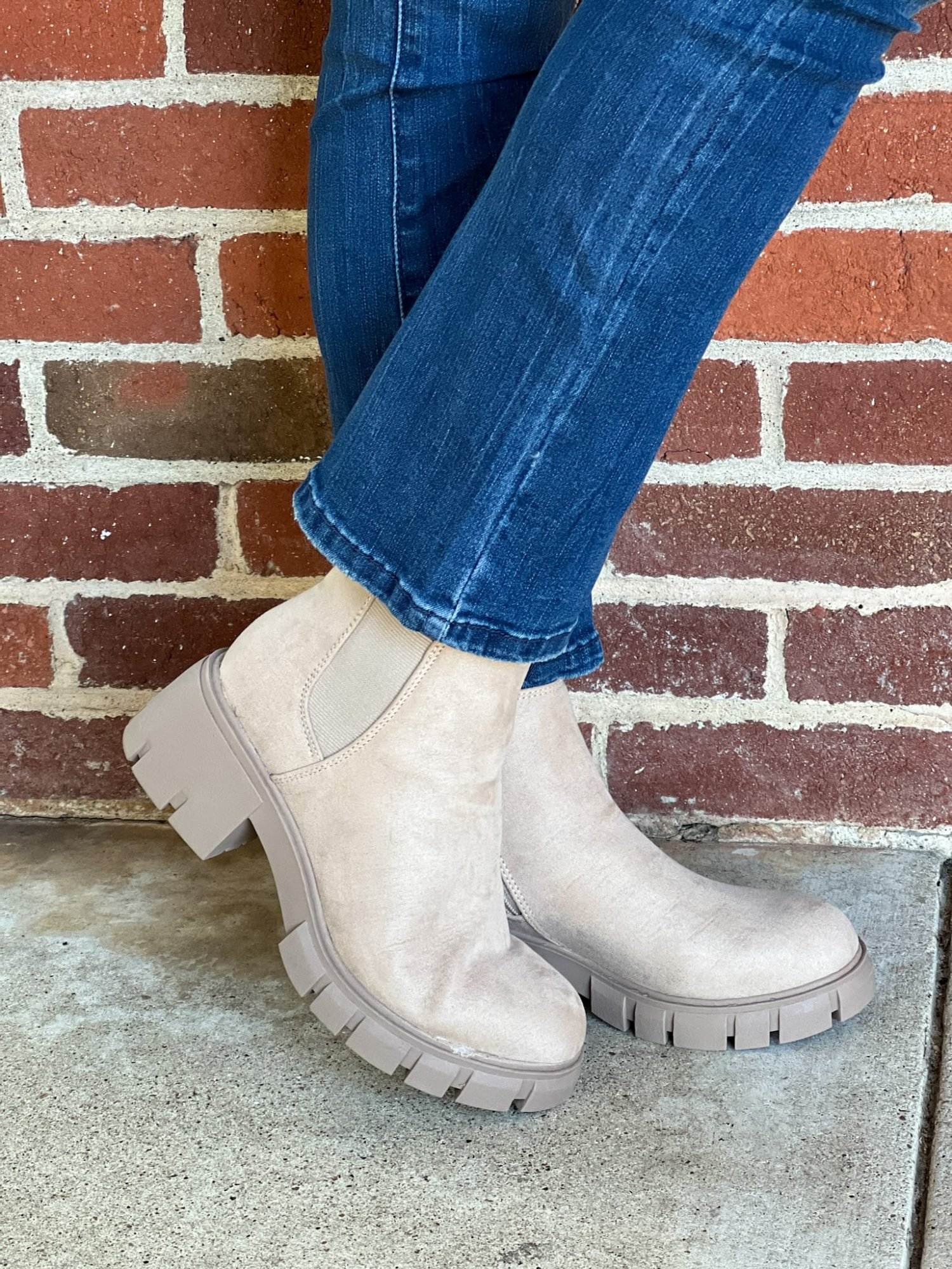 woman's feet in Lug Sole Chelsea Booties from walmart