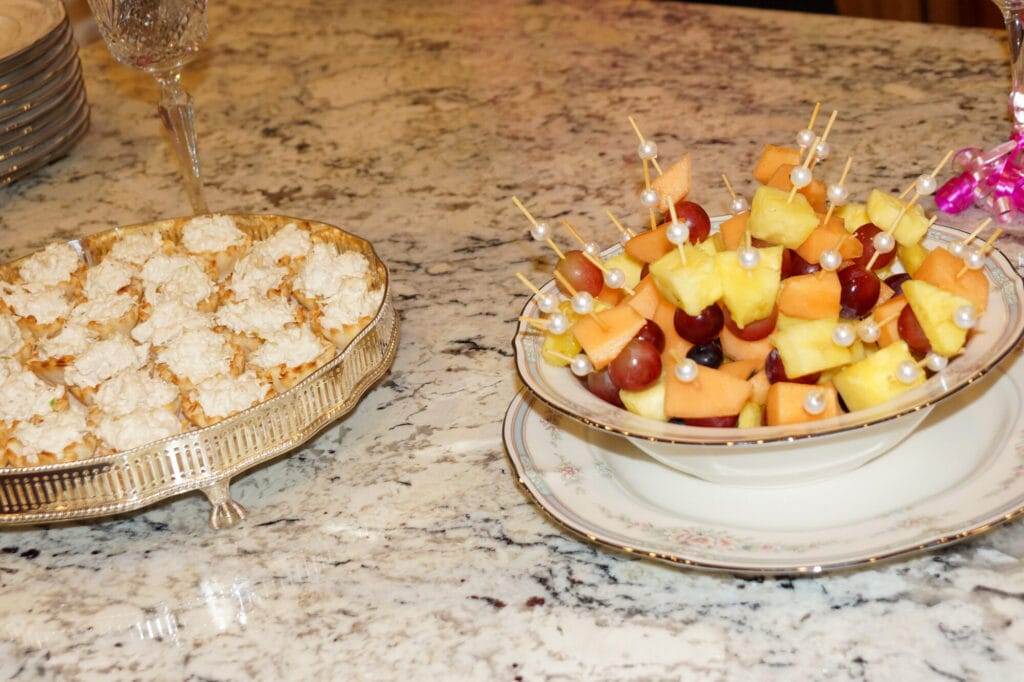 fruit skewers and chicken salad