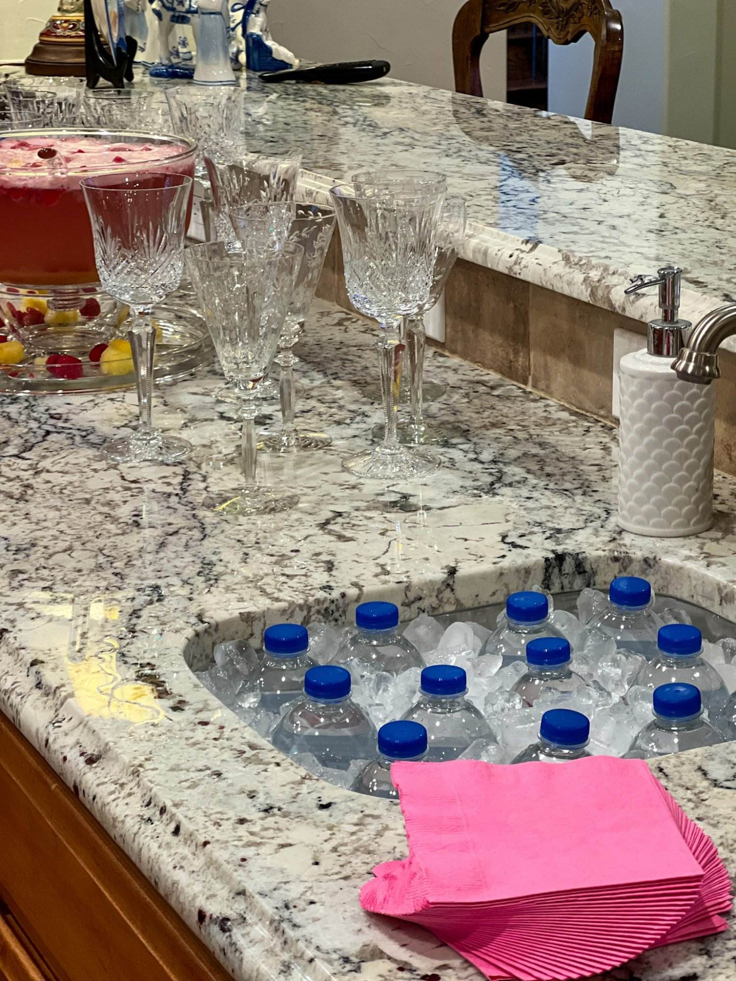 water bottle in-sink storage during a party