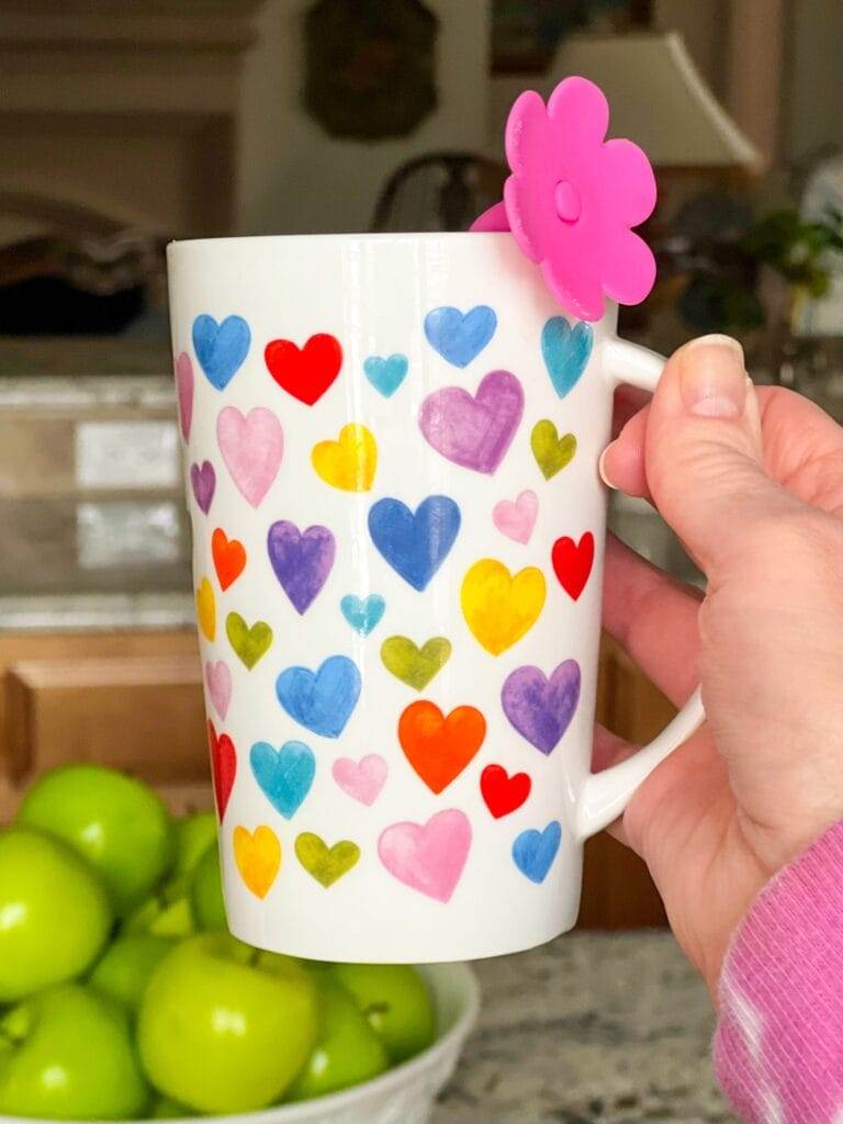 woman holding a tall valentine's mug