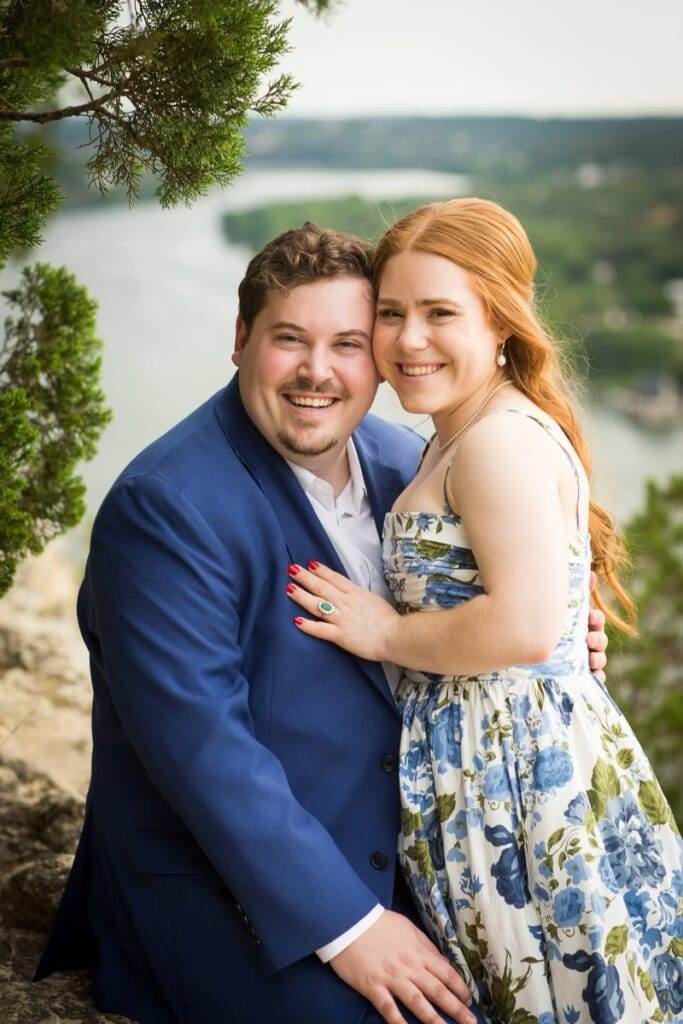 couple dressed in blue posing for engagement photos