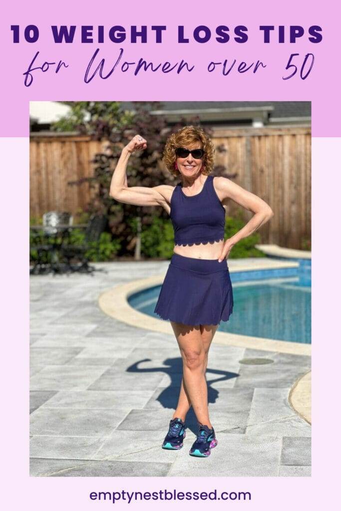 Picture of women in navy blue workout outfit standing by pool