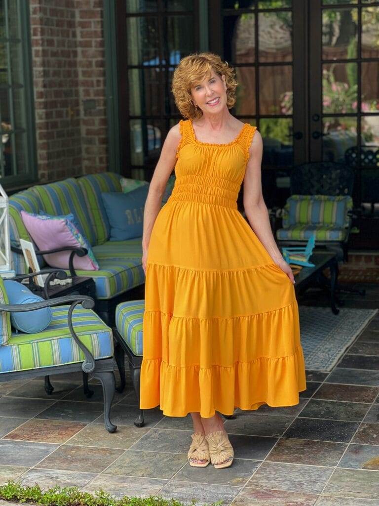 woman over 50 standing on back porch posing and wearing Antonio Melani Bentley Square Neck Pebble Crepe A-Line dress