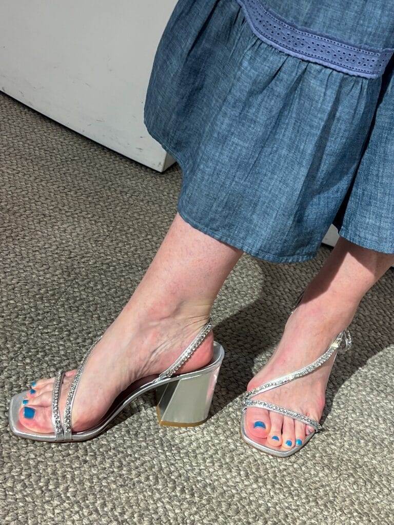 woman wearing blingy block heel sandals from stuart weitzman