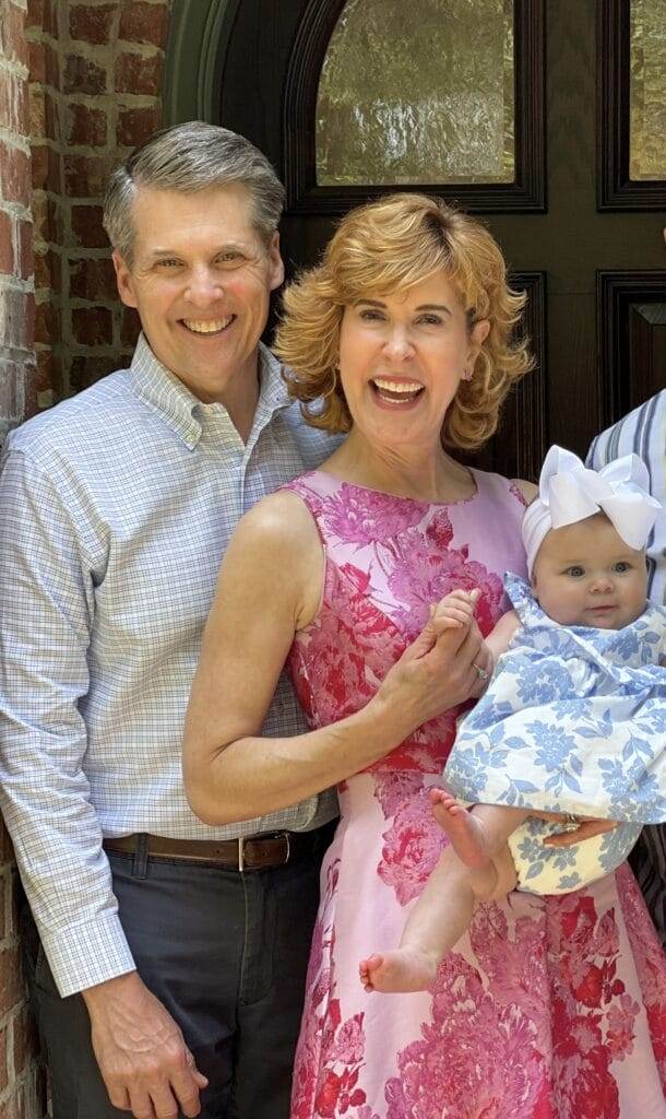 grandparents holding grandbaby