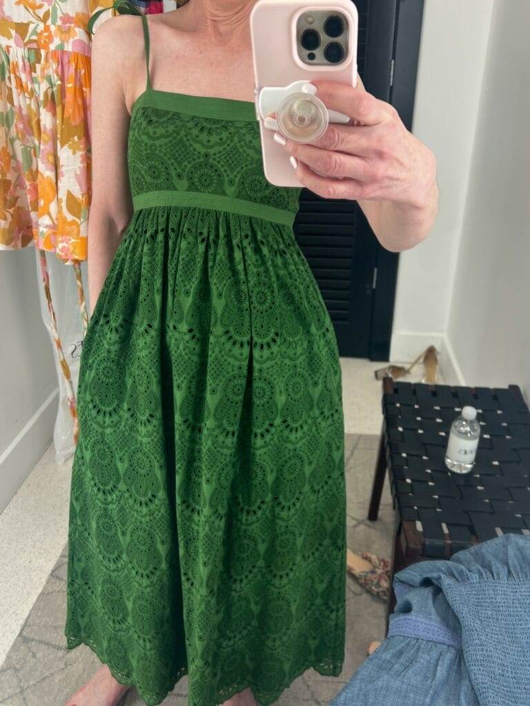 woman taking mirror selfie of green eyelet dress by ulla johnson