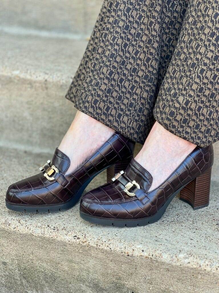 woman's feet on stairs 
wearing easy spirit mirror loafers