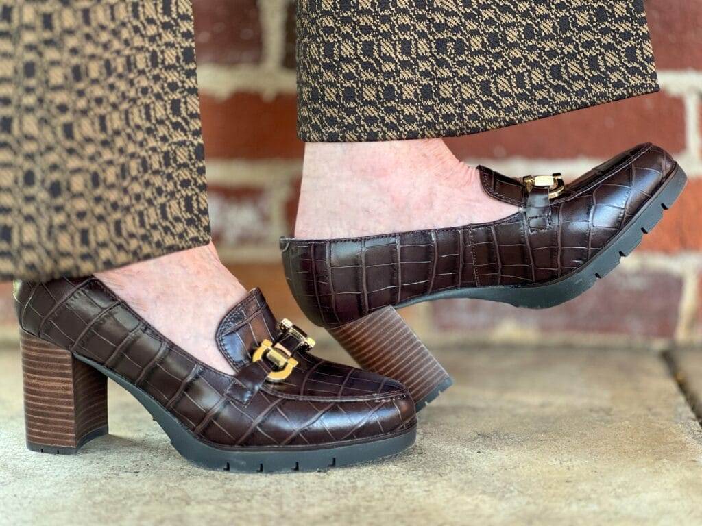 woman's feet wearing easy spirit mirror loafer pumps