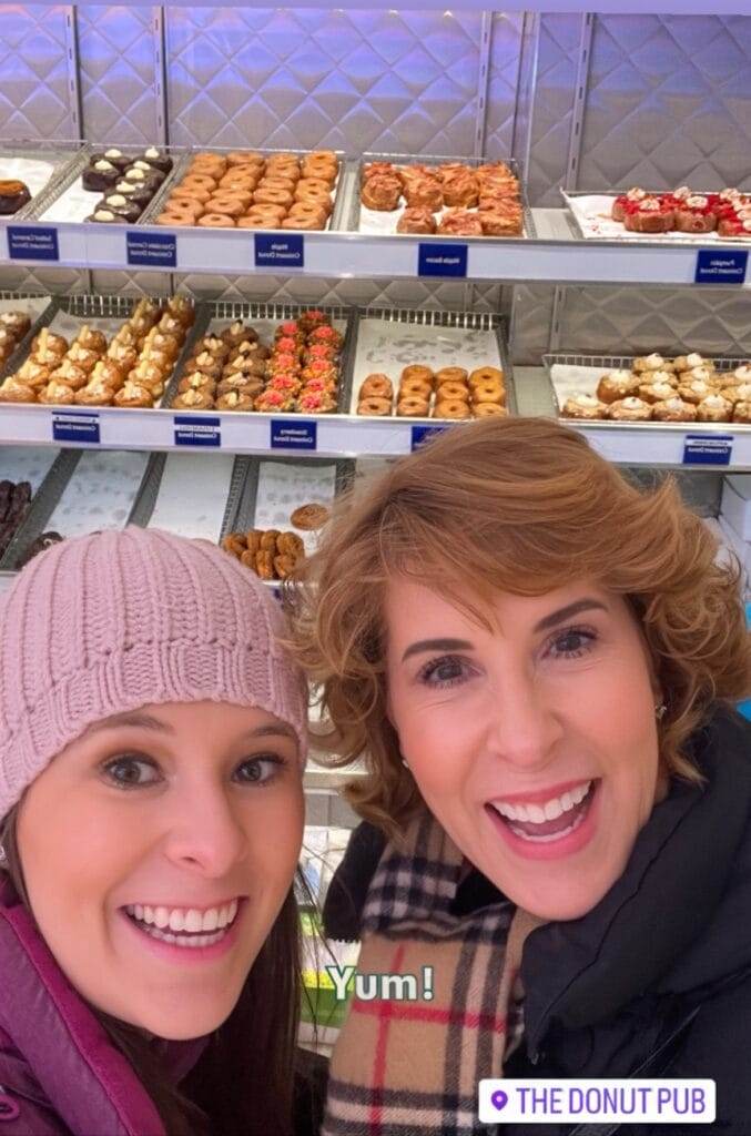 two women posing at the donut pub in nyc