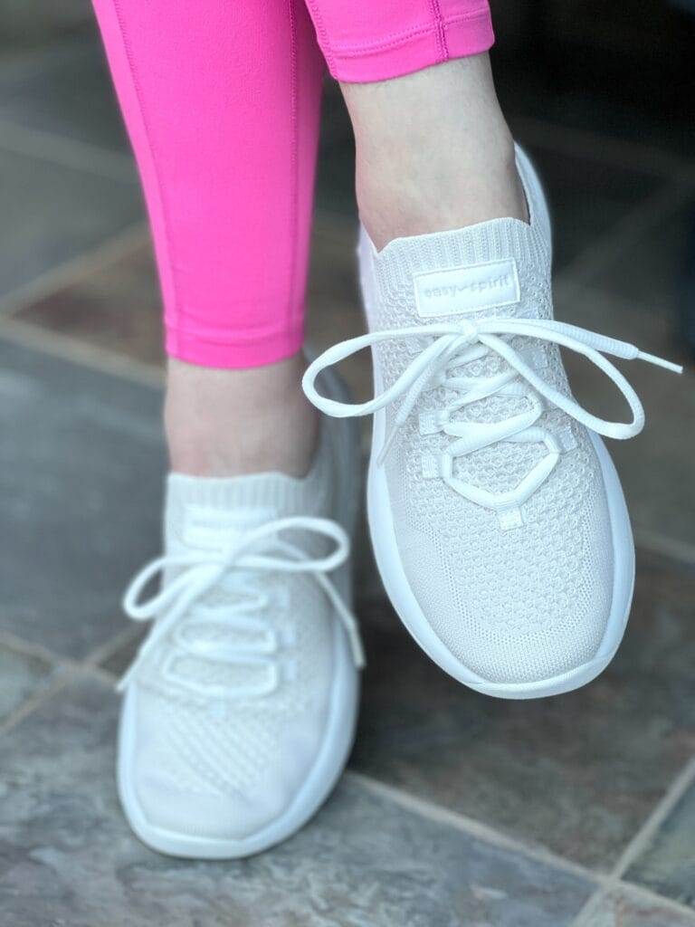 woman's feet wearing easy spirit sneakers