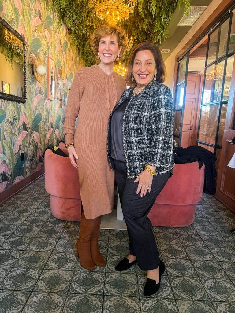 two women in a floral themed room