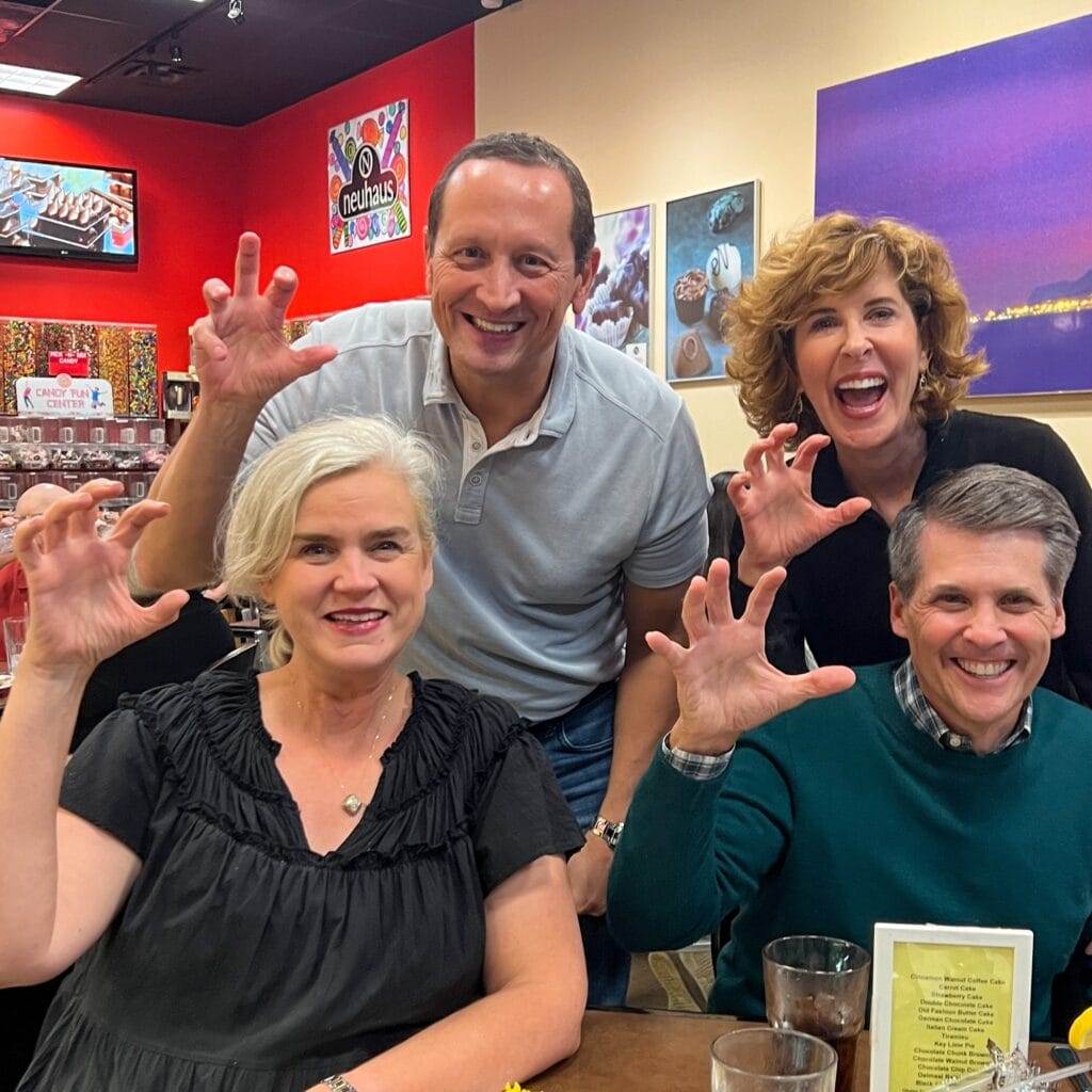 two couples on a double date doing sic em bears