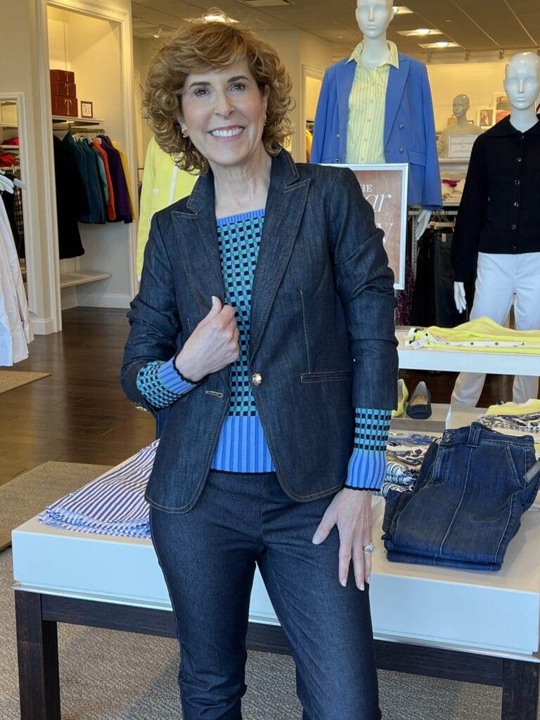 woman over 50 modeling a denim suit jacket at talbots