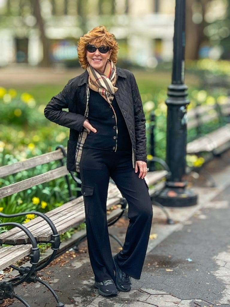 Woman dressed in black standing in Washington Square Park