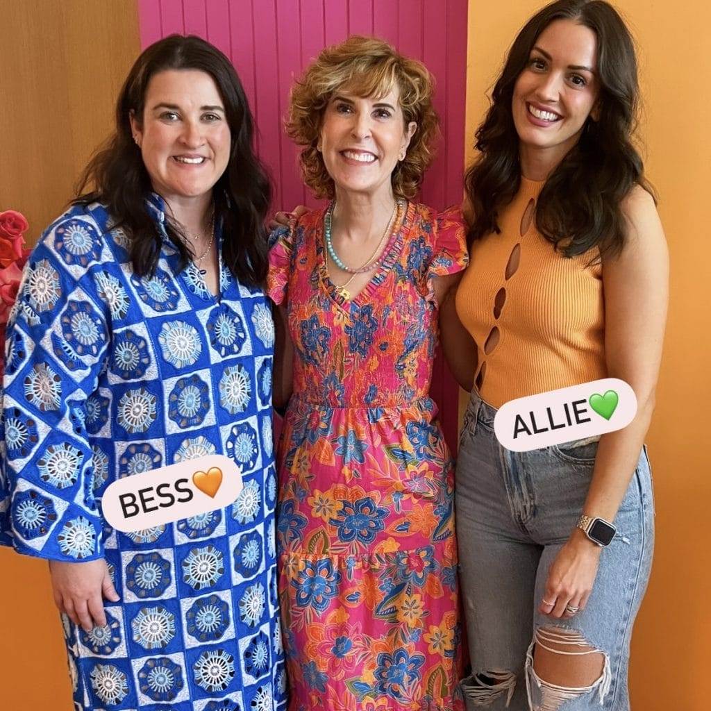 three women posing together 