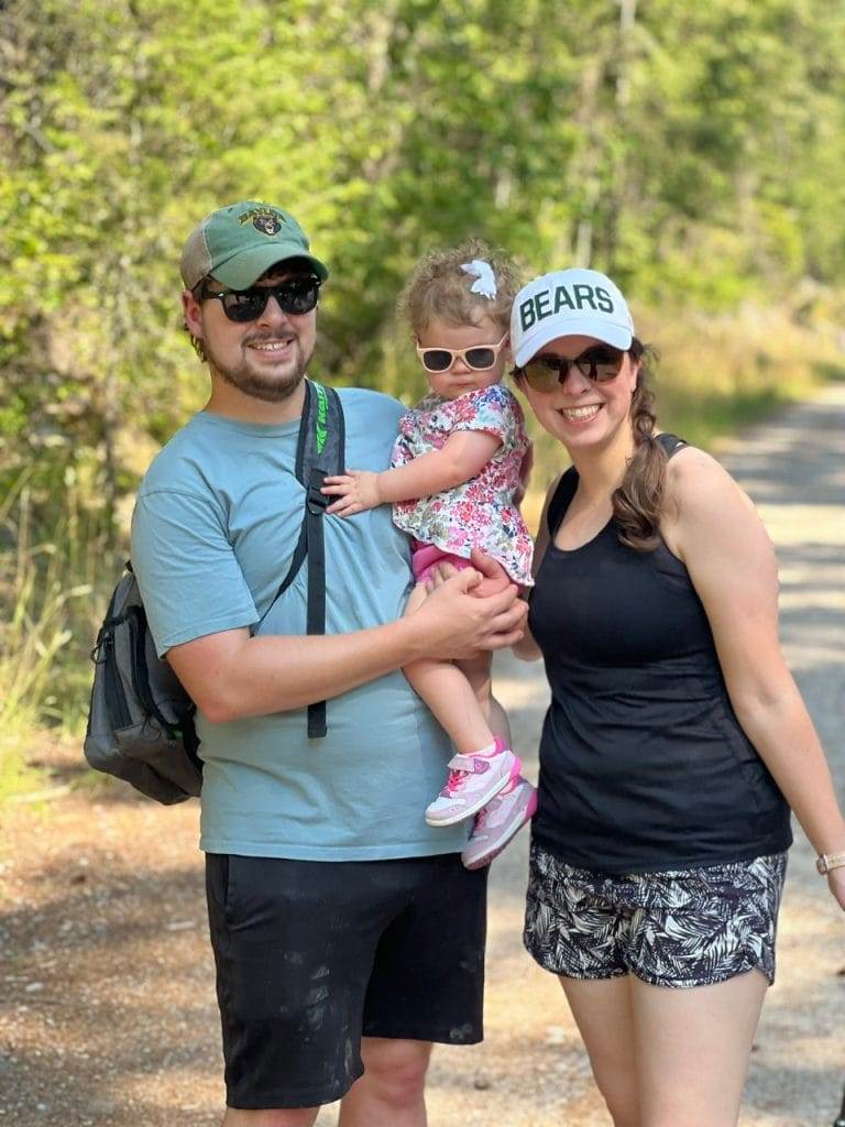 man, baby, and lady on swan river nature trail in bigfork montana