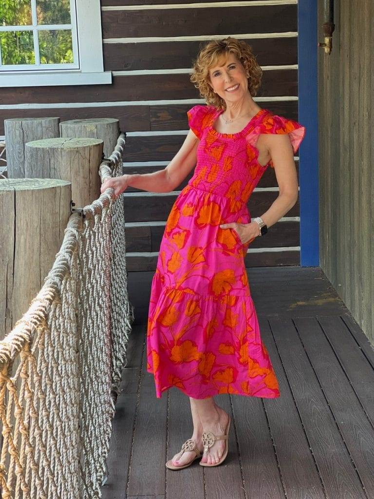 woman wearing pink and orange maxi dress