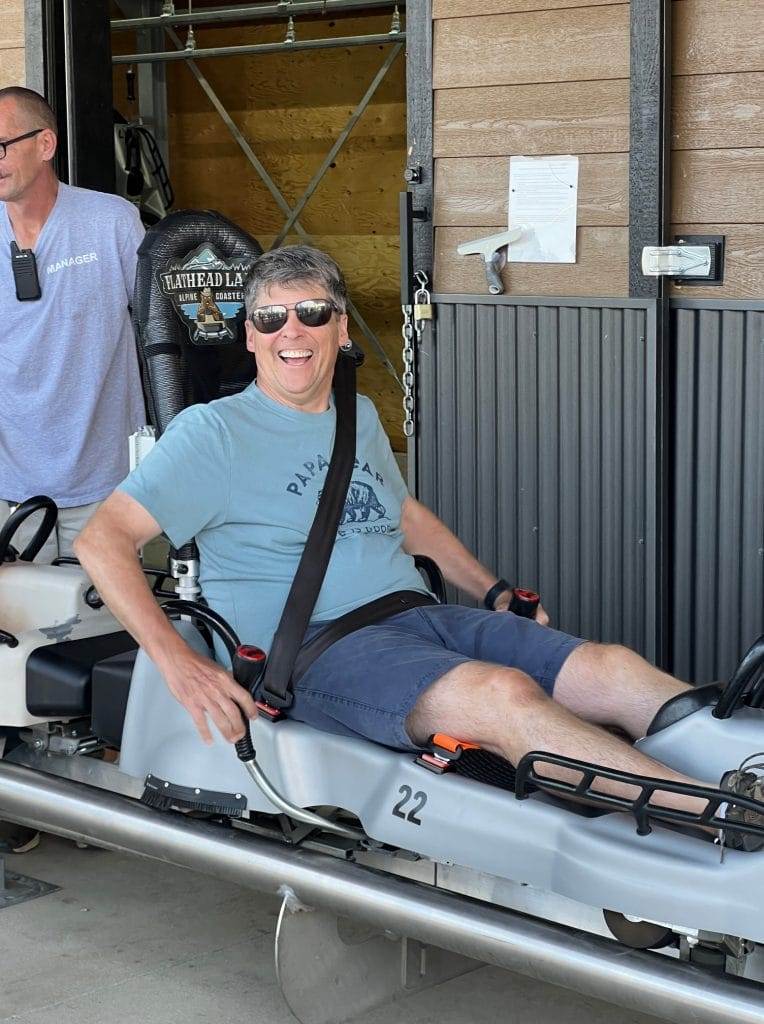 man getting ready to ride alpine coaster