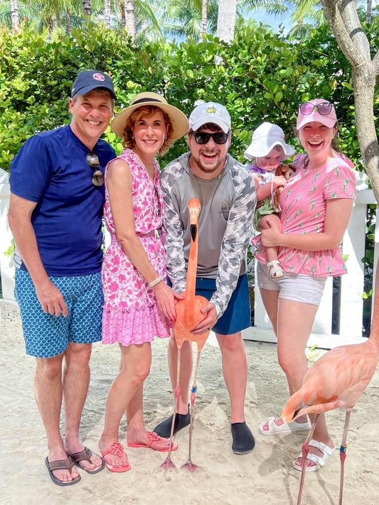 family holding a flamingo at baha mar