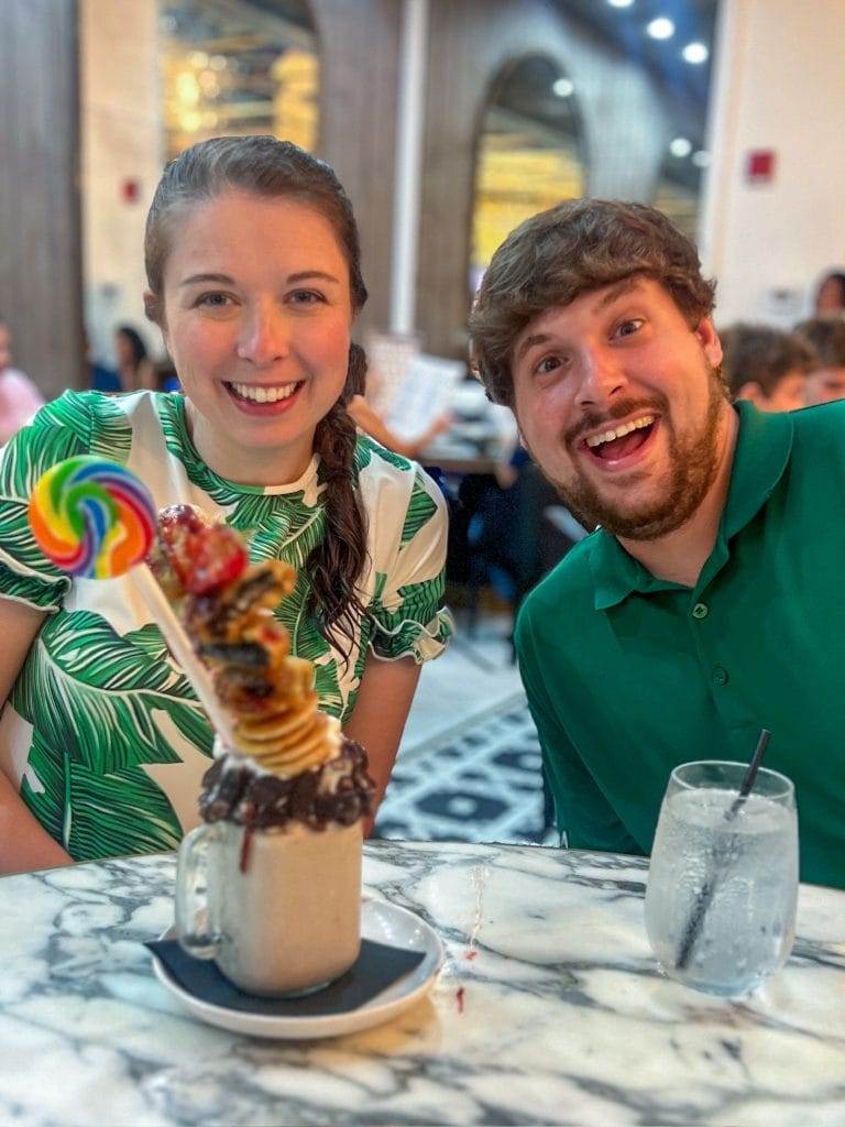 young couple enjoying a colorful dessert