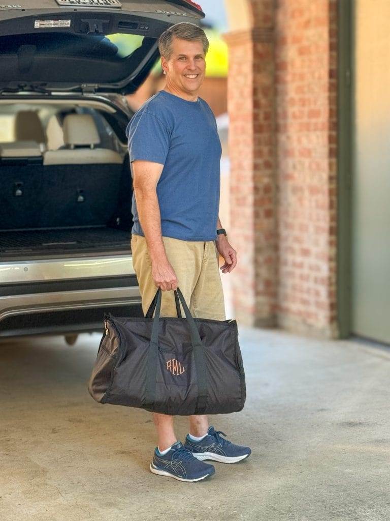 man carrying black weekender bag from marleylilly