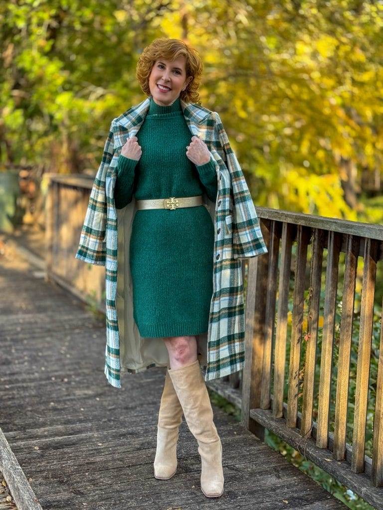 woman wearing talbots green sweater dress with walmart free assembly plaid coat over her shoulders