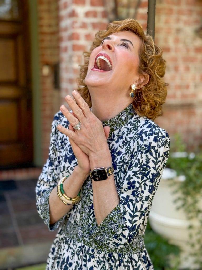 woman laughing and clapping